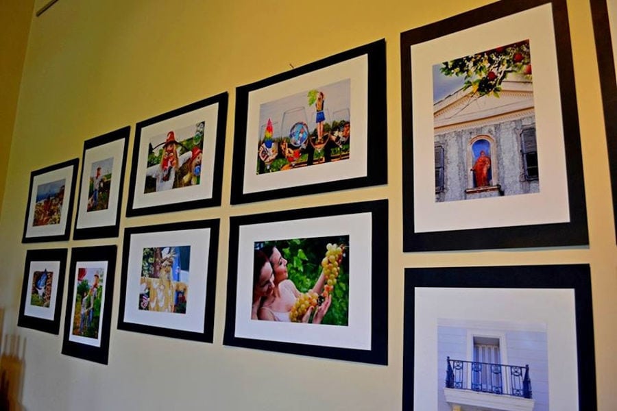 framed photos on the wall of 'Aidarini Winery'