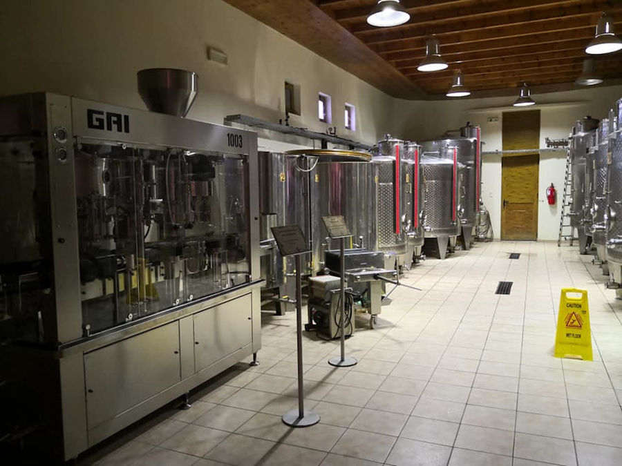 wine packaging machine and wine storage tanks at Hatziemmanouil Winery plant