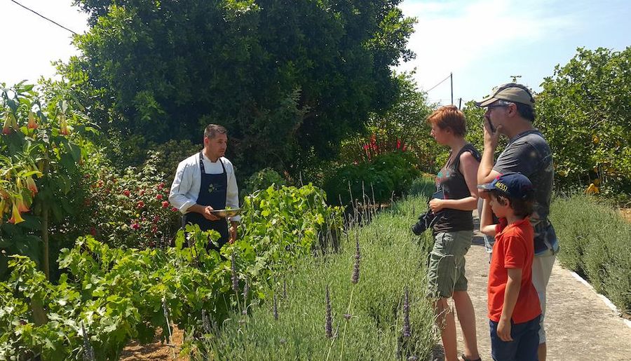 man taking photo to a guide in the garden - Gastronomy Tours.jpg