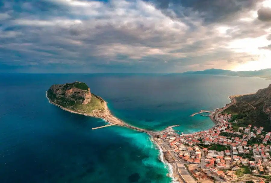 panoramic-view-of-the-ancient-hillside-town-of-monemvasia-in-the-southeastern-part-of-Peloponnese-peninsula-medieval-fortified-castle-town-of-Monemvasia-greece-e1710419355118.jpg.webp