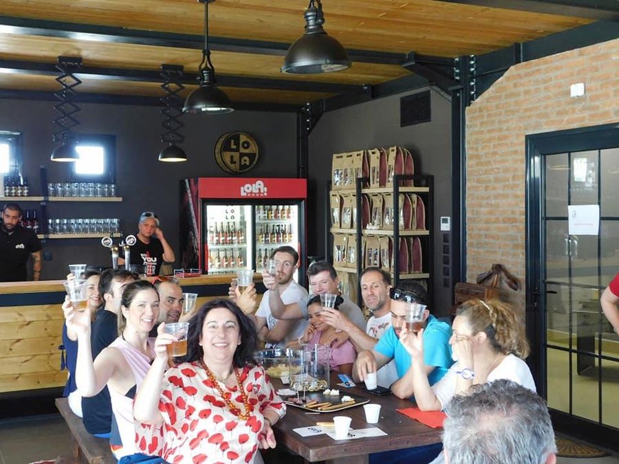 tourists smiling happily at the camera and raise their glasses of beer for 'cheers' -Gastronomy Tours.jpg