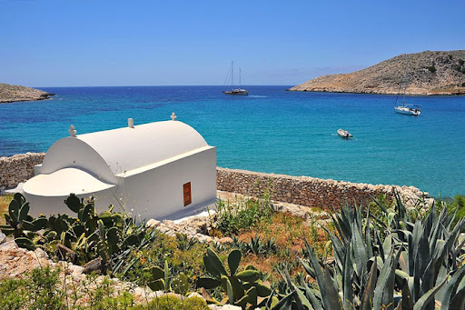White building by turquoise sea
