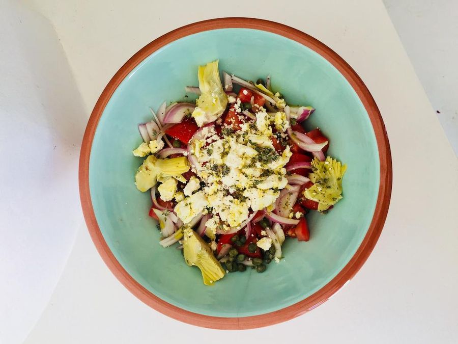 view from above of plate with traditional Greek salad and feta on the top–Gastronomy Tours.jpg