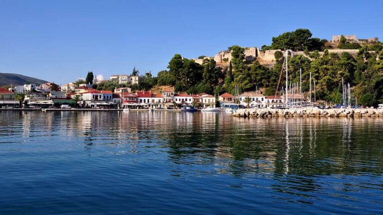 a body of water with buildings and trees