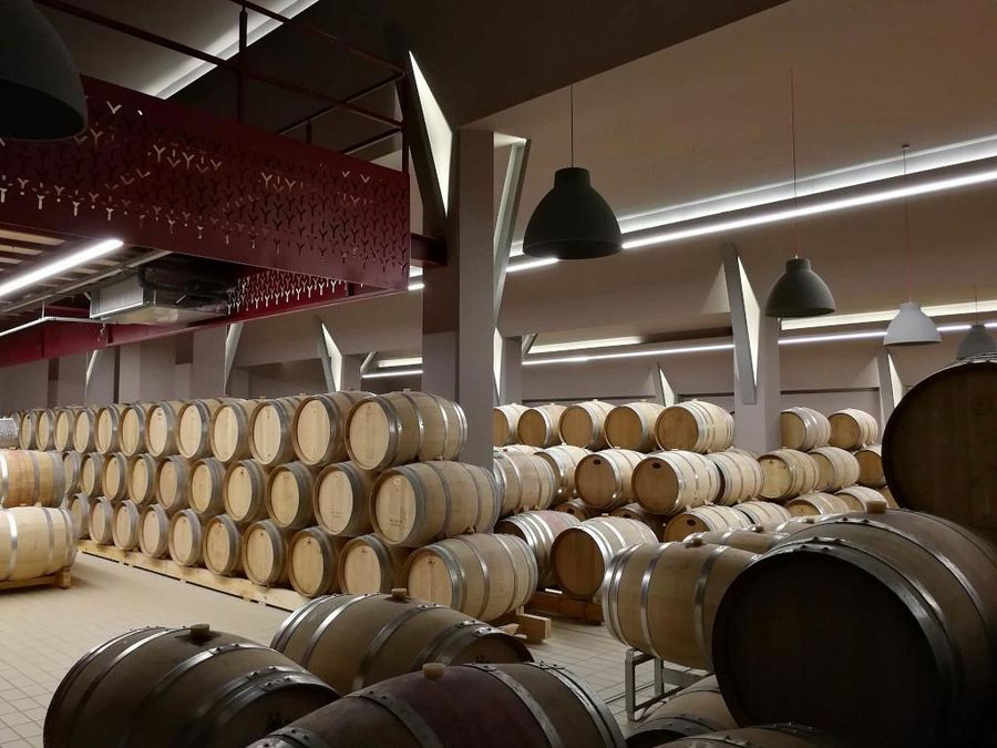 wine wood barrels on top of each other at Ktima Kir Yianni cellar-Gastronomy Tours.jpg